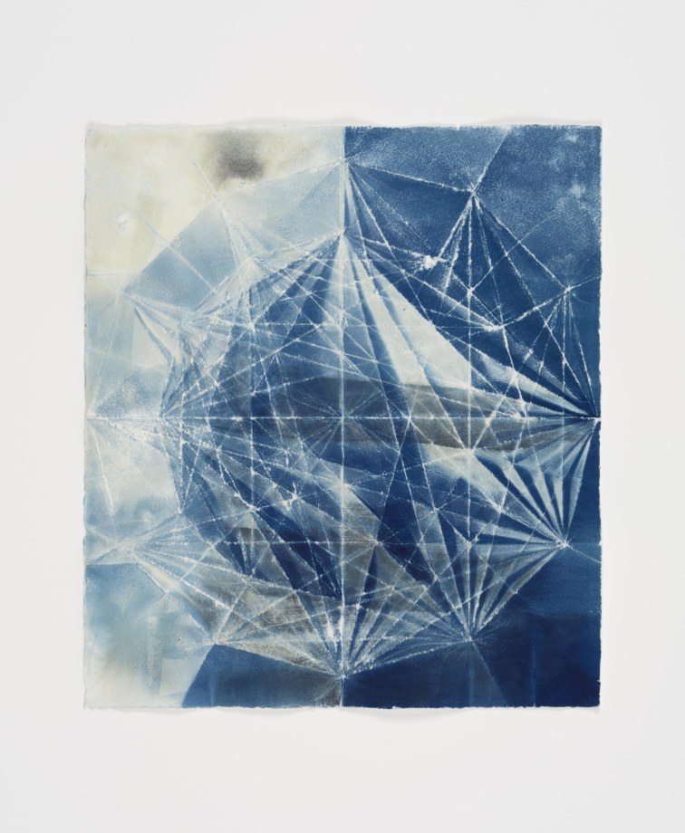 Abstract blue and white geometric shapes via cyanotype on folded paper