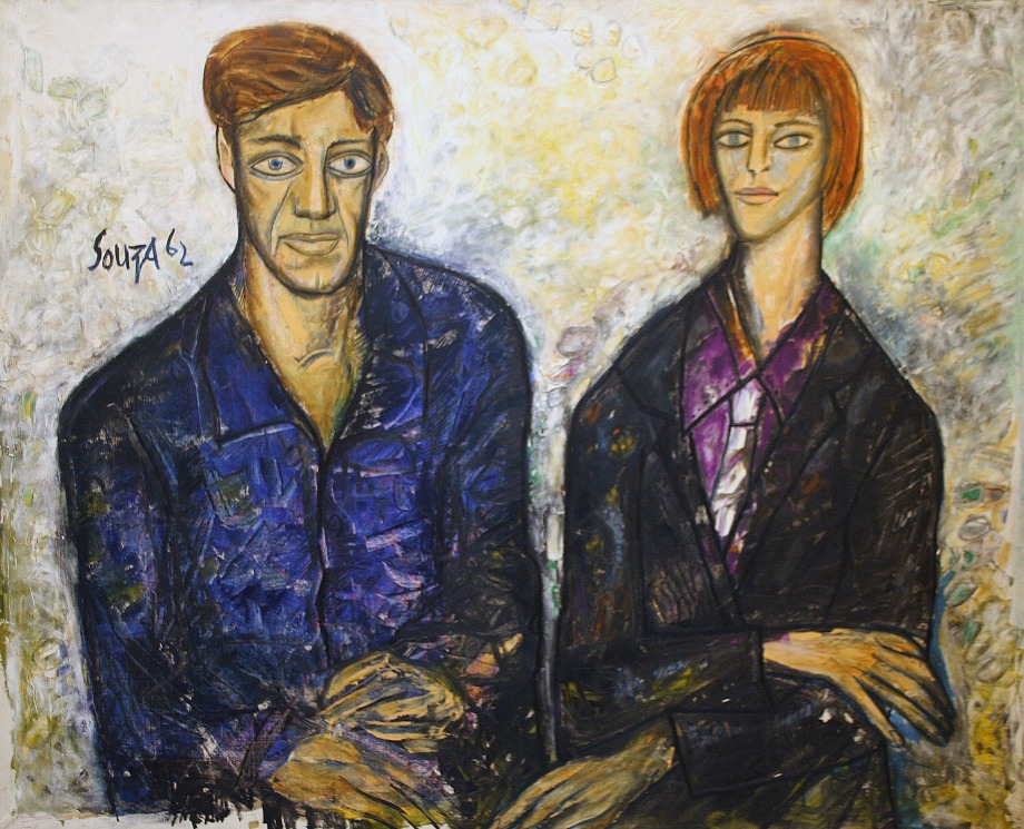 Portrait of a couple sitting on a light background