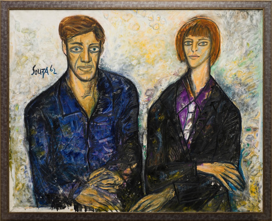 Portrait of a couple sitting on a light background