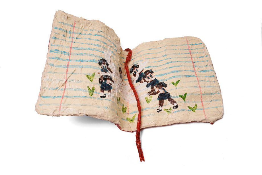 Sculptural object of a book with pictures of Sanbras inside