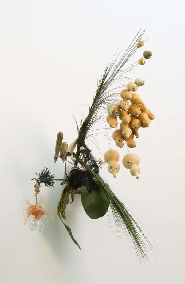 Rina Banerjee,&nbsp;Lentil flour, chickpeas mixed fermented friedballs presented in the leaf of bananas could cure the hunger of a labouring man,&nbsp;2008, Shells, gourds, acrylic, polyester banana leaves, nylon hair, fake grass, glass beads, gold thread, spoon, 47.25 x 31.25 x 51 in