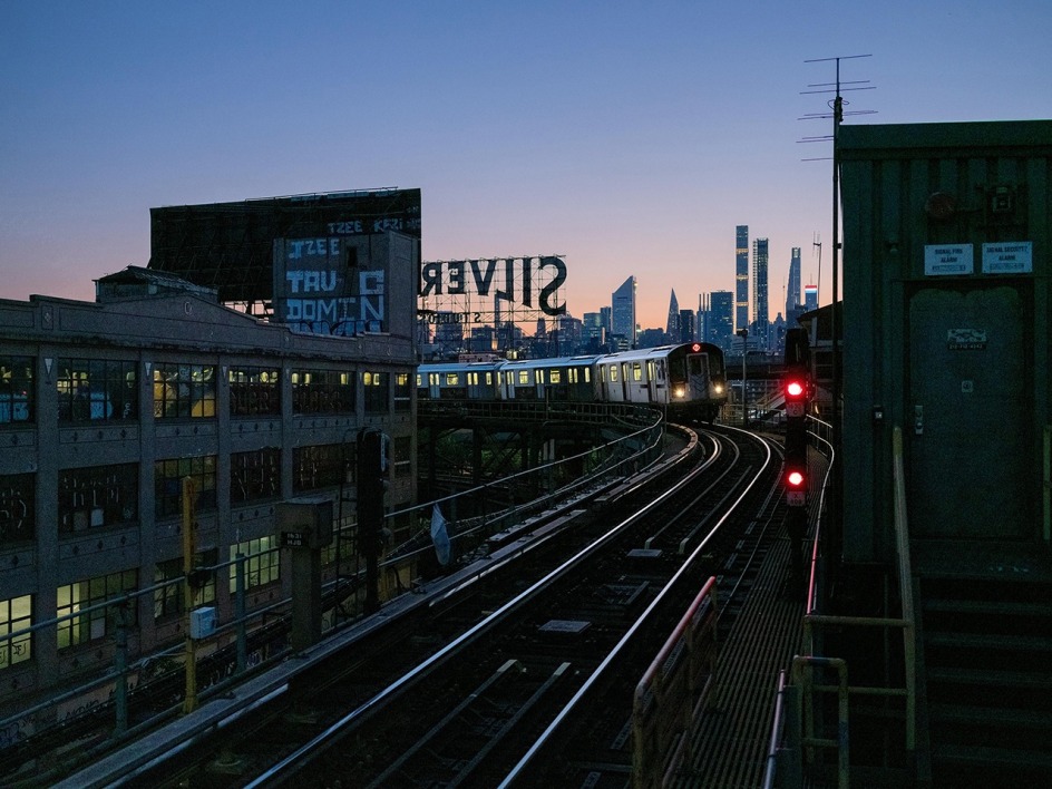 Lynn Saville,&nbsp;Train Tracks with Silver Sign, 2021. Archival pigment print, 20 x 24 inches.