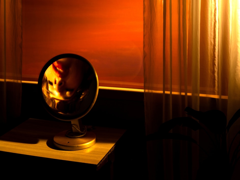 Tania Franco Klein,&nbsp;Rounded Mirror, Window (Self-portrait),&nbsp;2022, from the series Break in Case of Emergency. Archival pigment print, 29 1/2 x 39 3/8 inches.