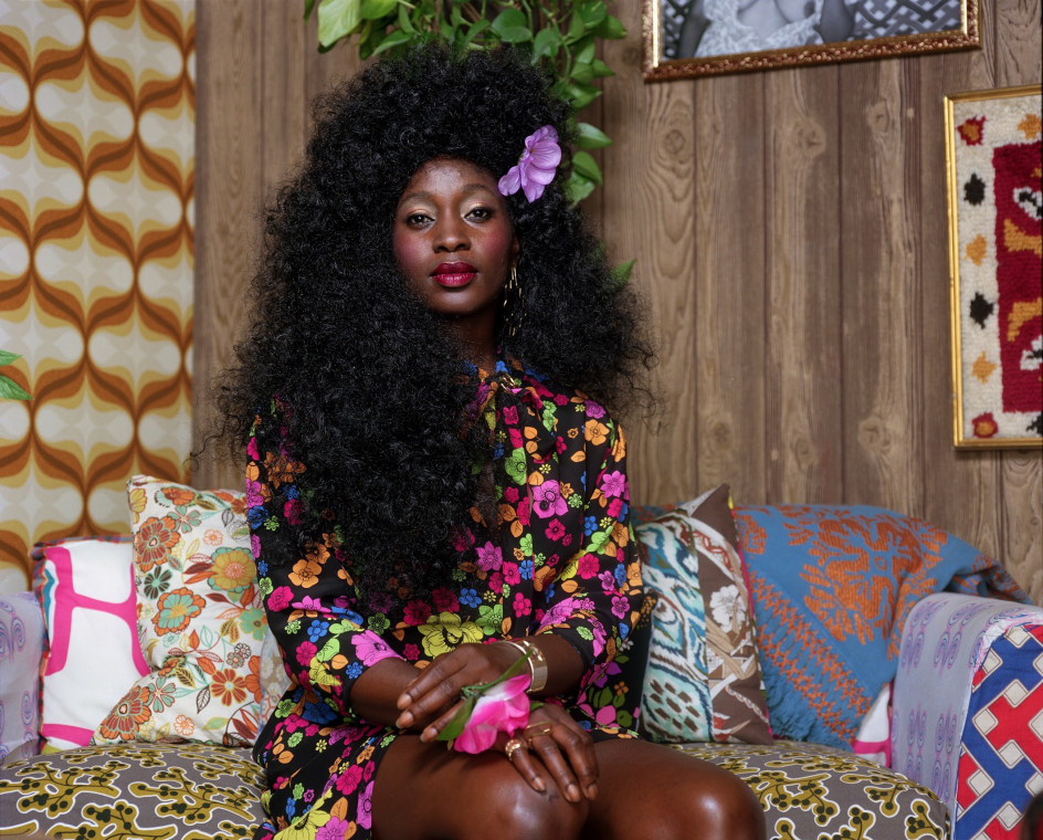 Mickalene Thomas, Portrait of Qusuquzah with Flower in Hair and Hand, 2022. Archival pigment print, 52 x 64 inches.