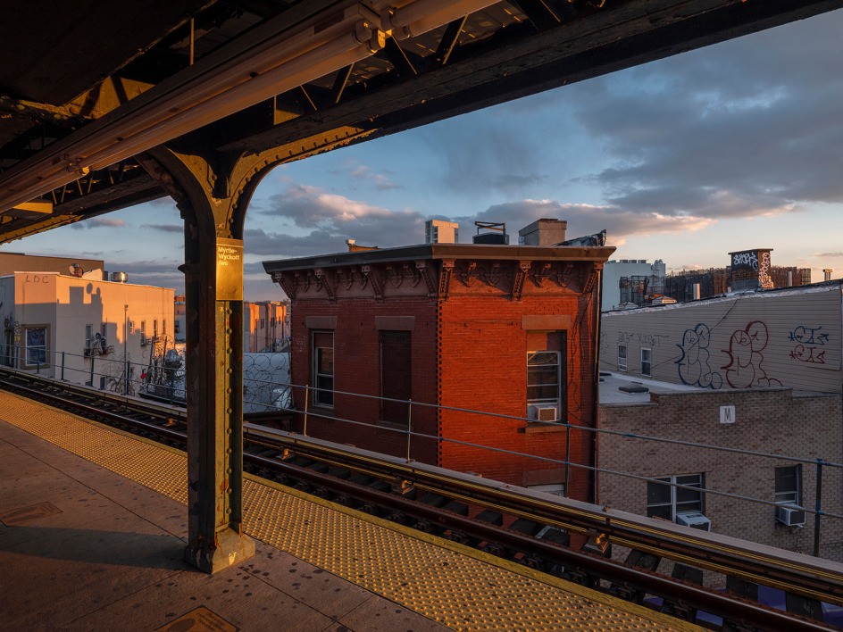 Lynn Saville,&nbsp;Red Building at Myrtle-Wyckoff Platform, 2022. Archival pigment print, 33 x 43 inches.