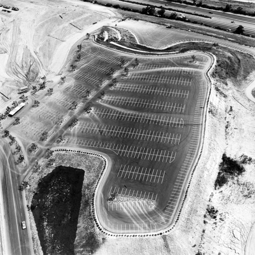 Ed Ruscha,&nbsp;Universal Studios, Universal City&nbsp;from the series Parking Lots, 1967/1999. 15 x 15 inches on a 20 x 16 sheet.