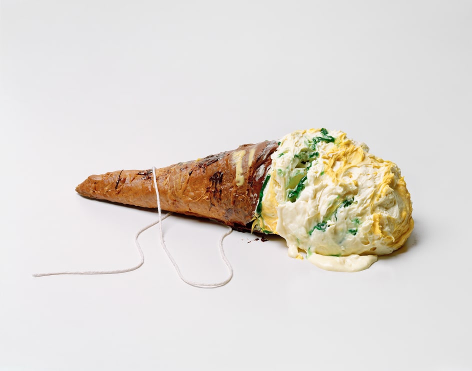 Photograph by Sharon Core. Ice cream cone lying on its side arranged to look like similar sculpture by Claes Oldenburg.