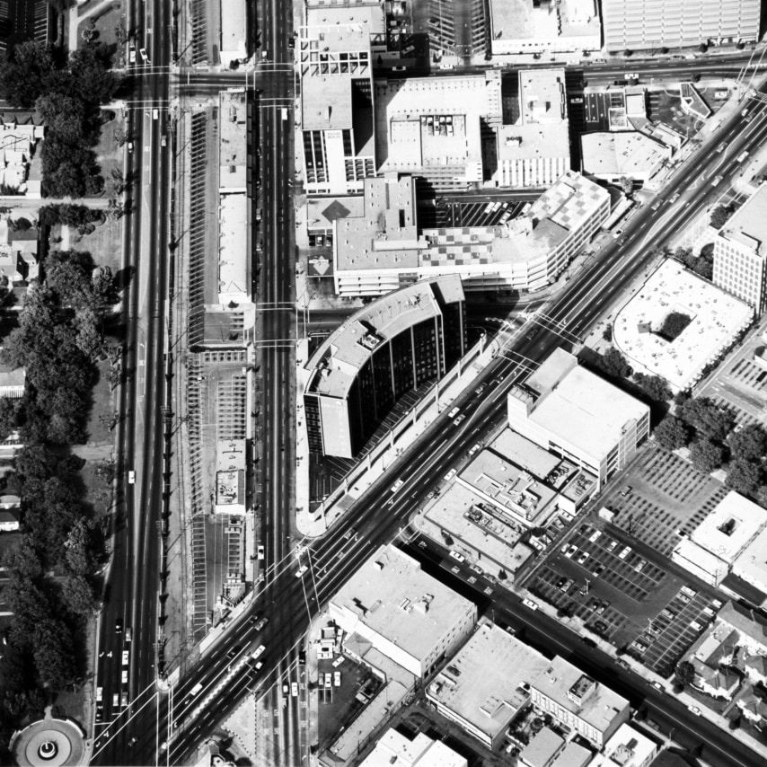 Ed Ruscha,&nbsp;Intersection of Wilshire Blvd. and Santa Monica Blvd.&nbsp;from the series&nbsp;Parking Lots, 1967/1999. 15 x 15 inches on a 20 x 16 sheet.