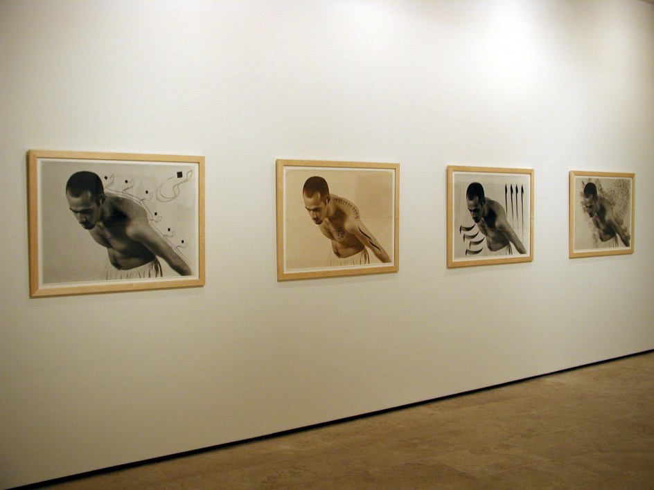 Four framed black and white and sepia tone photographs of a man in the exhibition Sadegh Tirafkan at Lehmann Maupin in New York in 2004