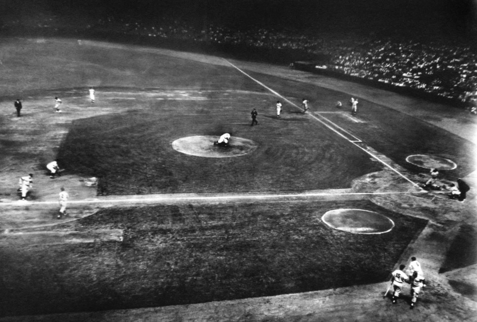 36.&nbsp;Ralph Morse (1917-2014), Homer Story at Cleveland Stadium in a Single Picture: Mickey Mantle hitting, rounding 1st, 2nd, 3rd, and being congratulated on his 23rd homer by Joe Collins (No. 15). Pitcher, catcher and third baseman are shown at moment Mantle hits ball, 1st and 2nd basemen as he jogs around, 1952