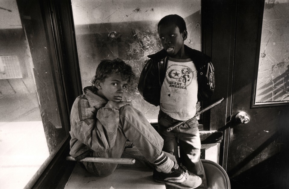6. Eli Reed,&nbsp;Child residents hanging out in security shack, Pink Palace housing project, San Francisco, 1981