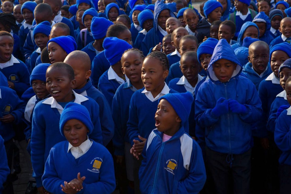 14. July 18th is Nelson Mandela Day Worldwide: The entire student body at Holy Cross Anglican school joined in singing the Happy Birthday song to Nelson Mandela, who turned 95 years old today, Soweto Township, South Africa, July 18, 2013.