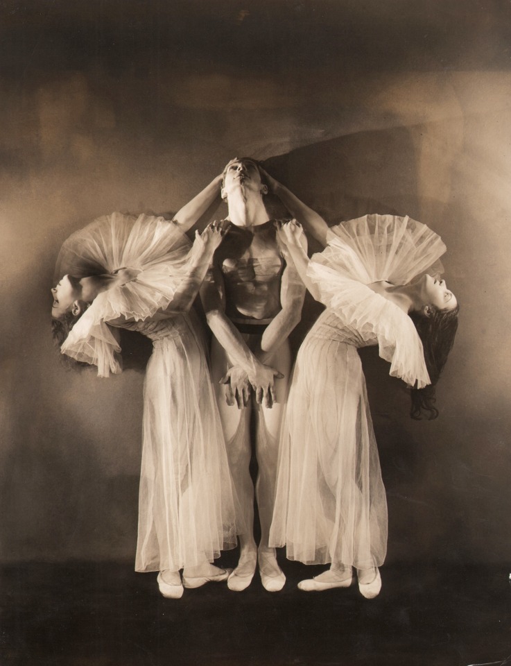 George Platt Lynes, Errante, ​1935. Two female dancers lean back from a central male figure, their hands on his shoulders and head.