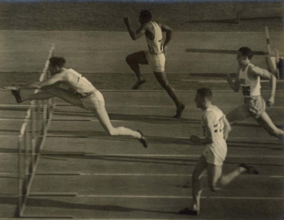 36. Leni Riefenstahl (German, 1902-2003), 38 - Towns in the end spurt series one (110 m Hurdles Final, The winner Towns -USA in front), 1936, Vintage Gelatin Silver Print, 9&rdquo; x 11&rdquo;