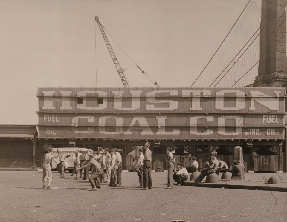 Paul J. Woolf, Baseball Game, c. 1933. Men play baseball in front of a structure marked &quot;Houston Coal Co.&quot;