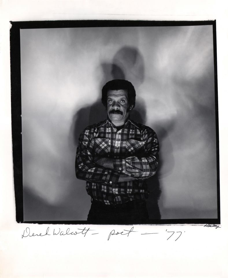 Anthony Barboza, Derek Walcott - Poet, ​1977. Subject stands in center of square frame with arms crossed, multiple shadows cast onto backdrop.