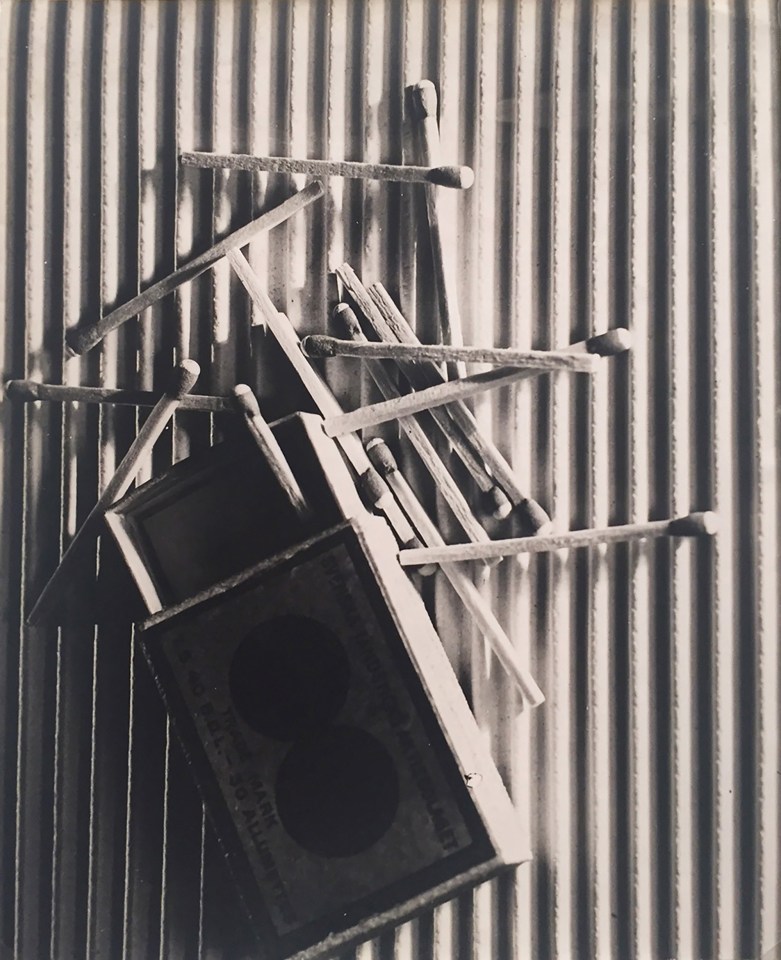 Claude Tolmer, Untitled (Matches), ​1933. An open matchbox surrounded by matches on a ridged surface.