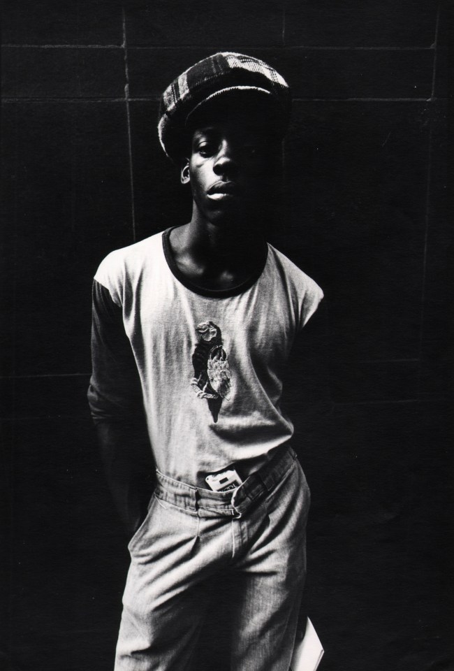 30.&nbsp;Ozier Muhammad, (American, 1950), Kool: A Young Man Strikes a Pose in Downtown Chicago, 1973, Gelatin Silver Print, 12.5&rdquo; x 8.5&rdquo;