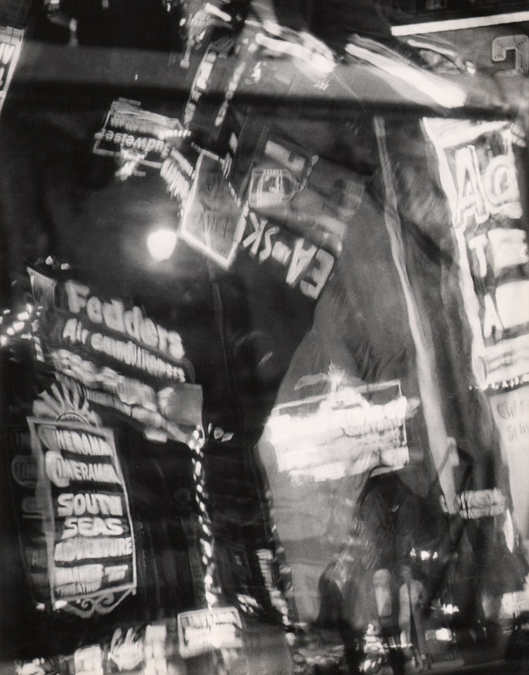 29. David Attie, Untitled, c. 1955. Distorted view of various lit signs and advertisements at night.