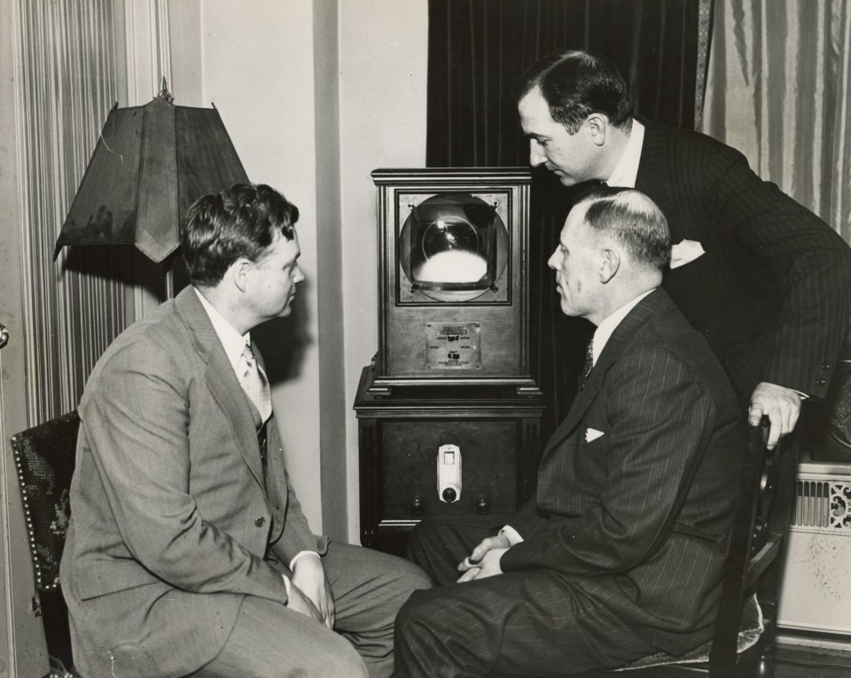 6. International News Photos, Inc, Receiving First Synchronized Sight and Sound Broadcast D.E. Replogle, VP of the Jenkins Television Corporation, E.J. Gough of Hearst Radio Service&nbsp;and Director John A. Kennedy, New York, 1931, Gelatin Silver Print, 8&rdquo; x 10&rdquo;