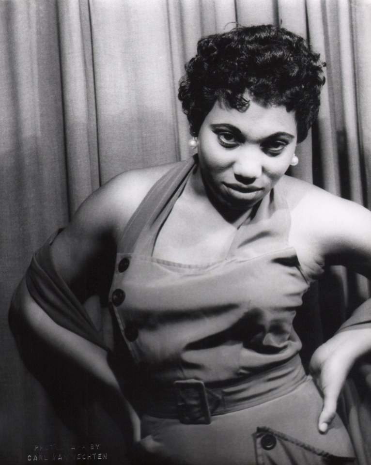 10. Carl Van Vechten, Leontyne Price in Porgy &amp; Bess, 1953. Subject poses against a curtain with hands on hips, looking to the camera.