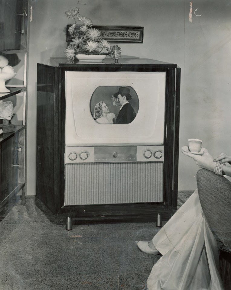 12. Photographer Unknown, Full-door mahogany console&nbsp;color television set originally&nbsp;for sale for $1,100 with a 15&rdquo;&nbsp;screen masked to a 12.5&rdquo;&nbsp;picture size, 1954, Gelatin Silver Print, 10&rdquo; x 8&rdquo;