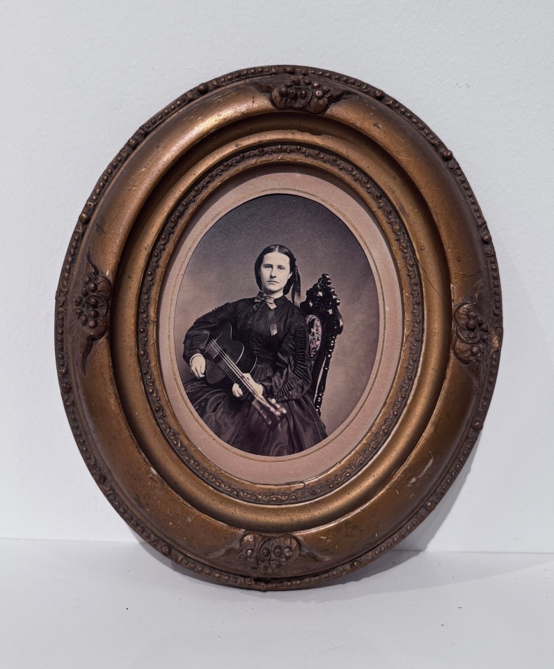 MINI OVAL ALBUMEN PORTRAIT OF GUITARIST, NETTIE E. MARIE