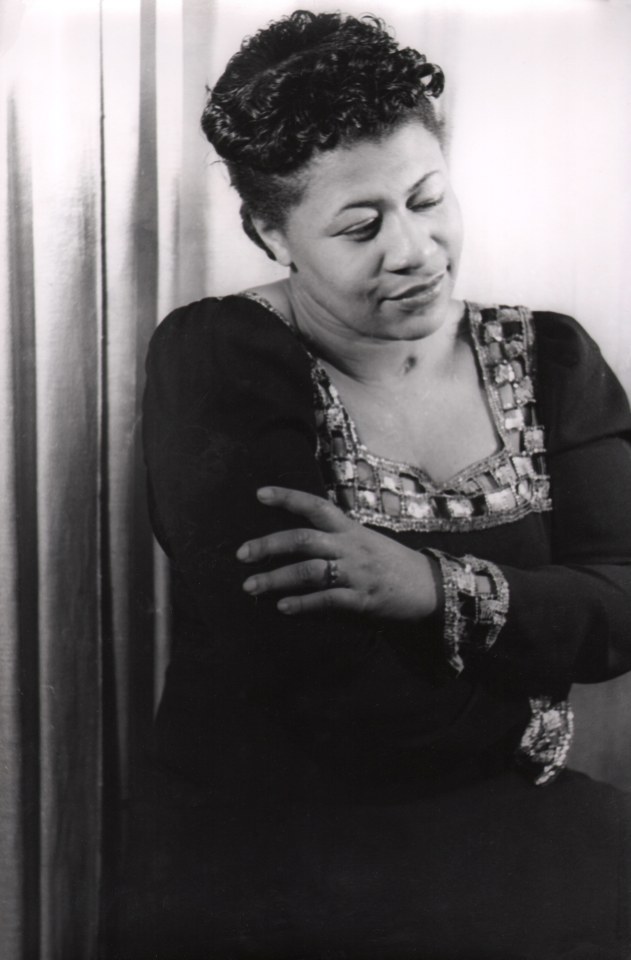 02. Carl Van Vechten, Ella Fitzgerald, 1940. Waist-up portrait of the singer, eyes downcast and arms crossed.