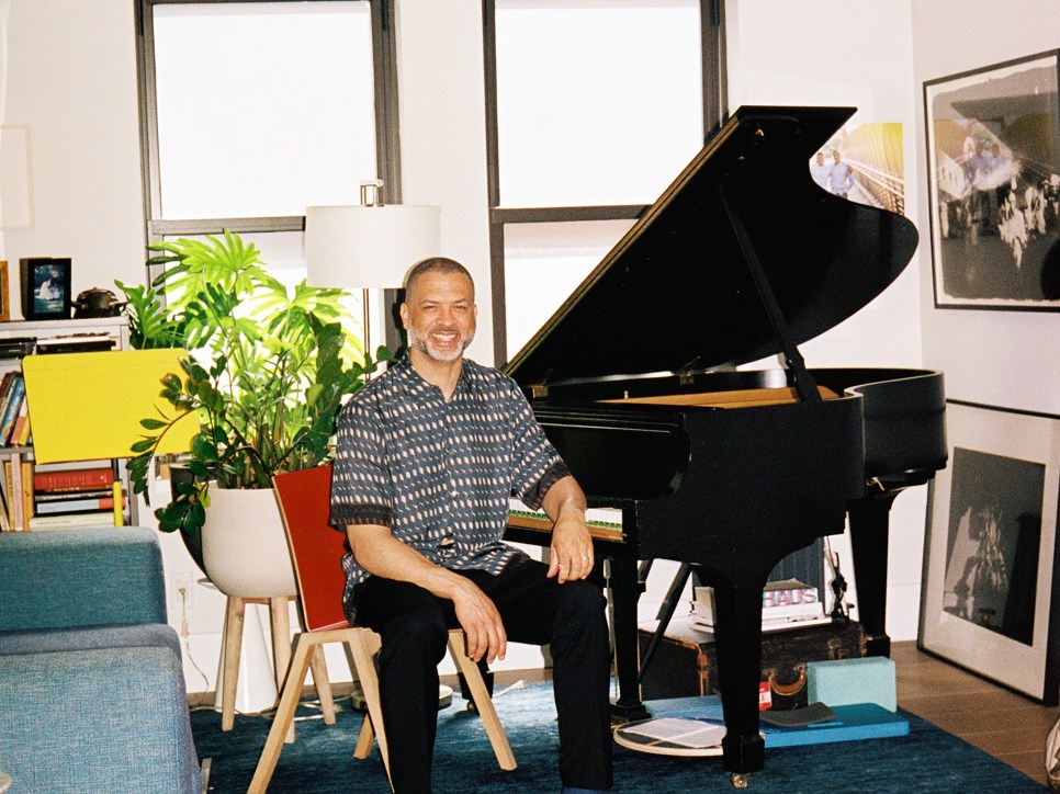 Jason Moran sitting in front of a grand piano 