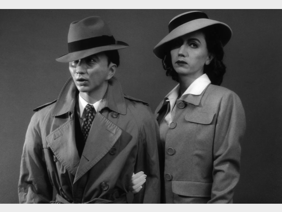 Black and white photo of a man and a woman wearing hats
