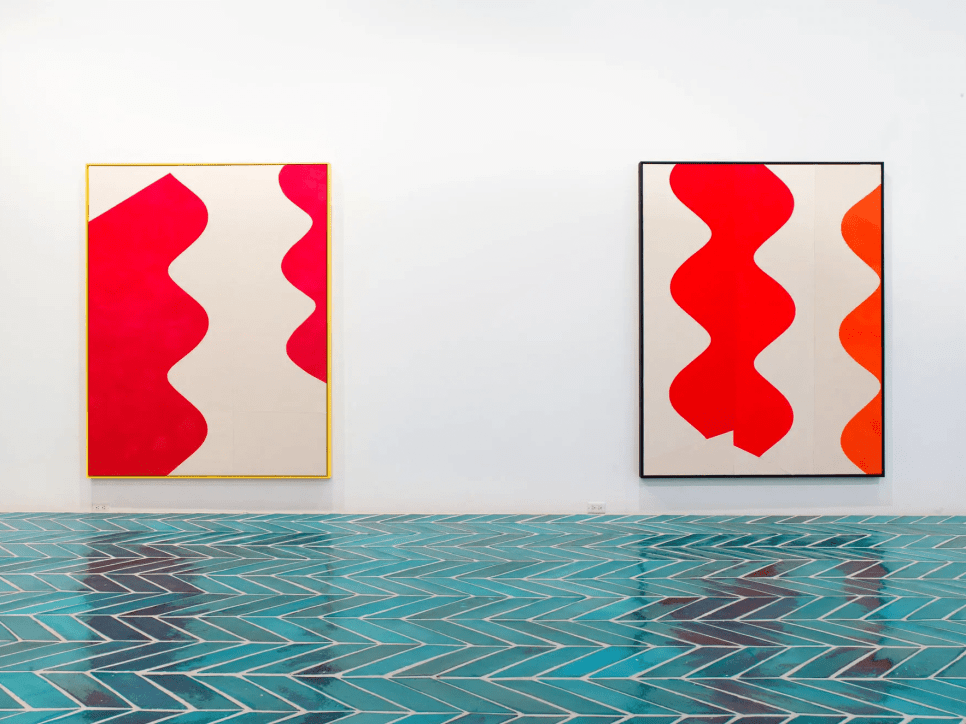 2 paintings in a gallery space with turquoise tiled floor