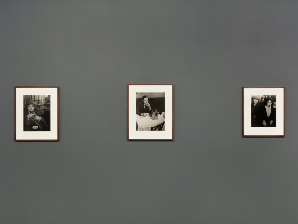 Installation view of black and white photographs by Brassaï