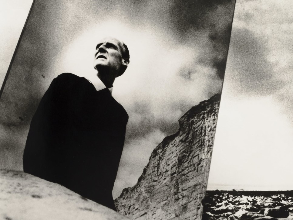 Black and white photographic portrait of Bill Brandt with mirror in nature