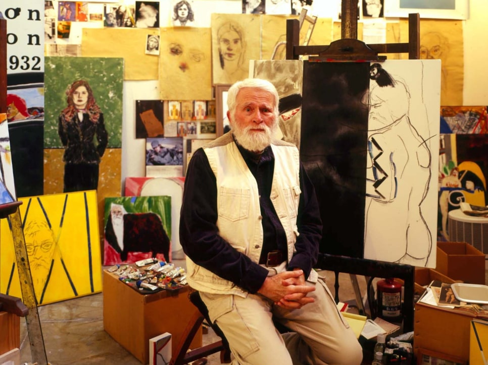 Color photographic portrait of R.B. Kitaj in his Studio surrounded by paintings