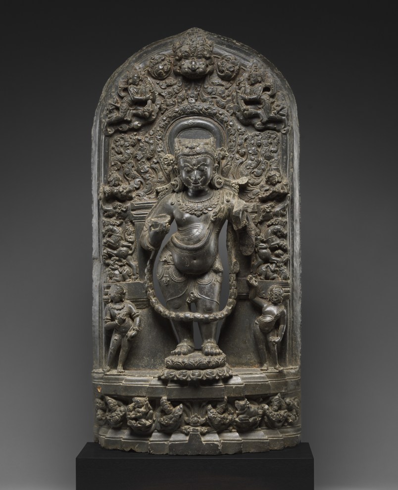 The wrathful form of Shiva is depicted standing in tribhanga on a lotus