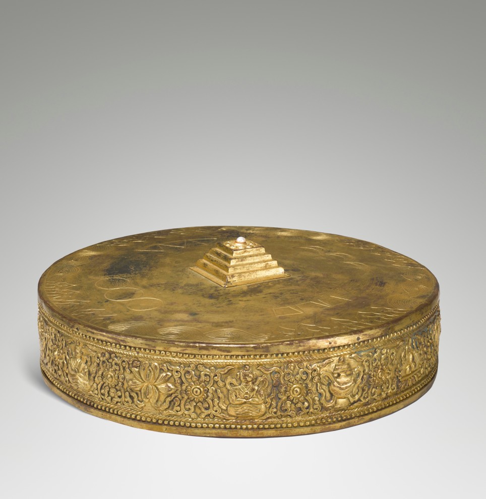  The five-terraced pyramid at the center of this three-dimensional metal mandala represents Mount Meru (or Sumeru), the cosmic mountain that in Indian cosmology is the axis of the universe and the dwelling place of the gods. 