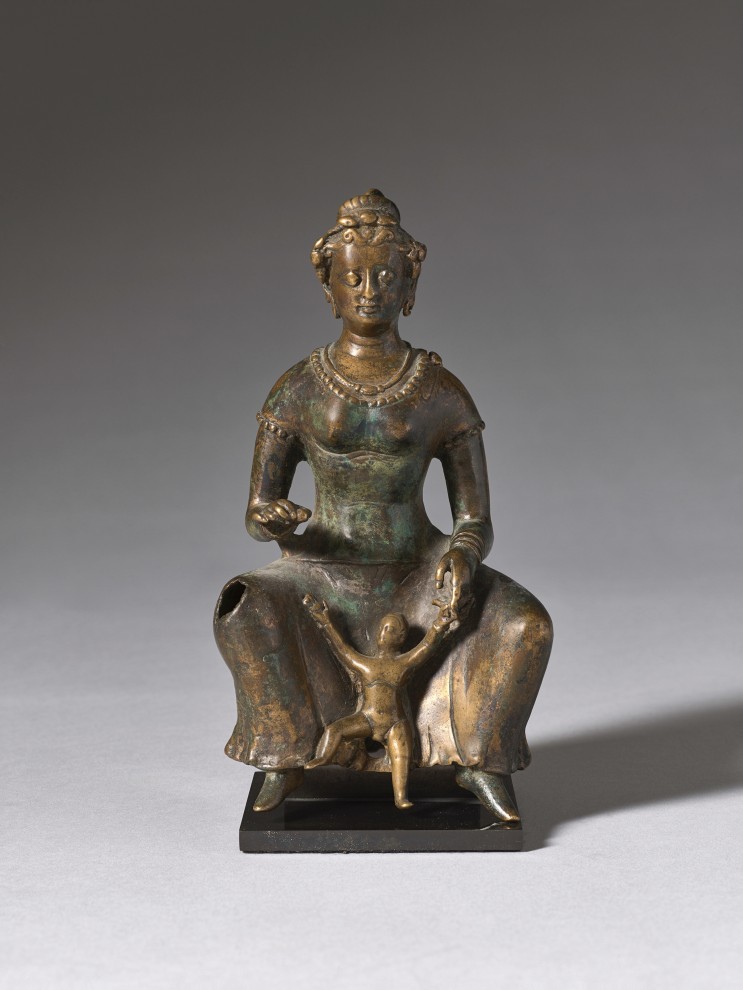 Small bronze sculpture of a seated mother with her child playing between her legs